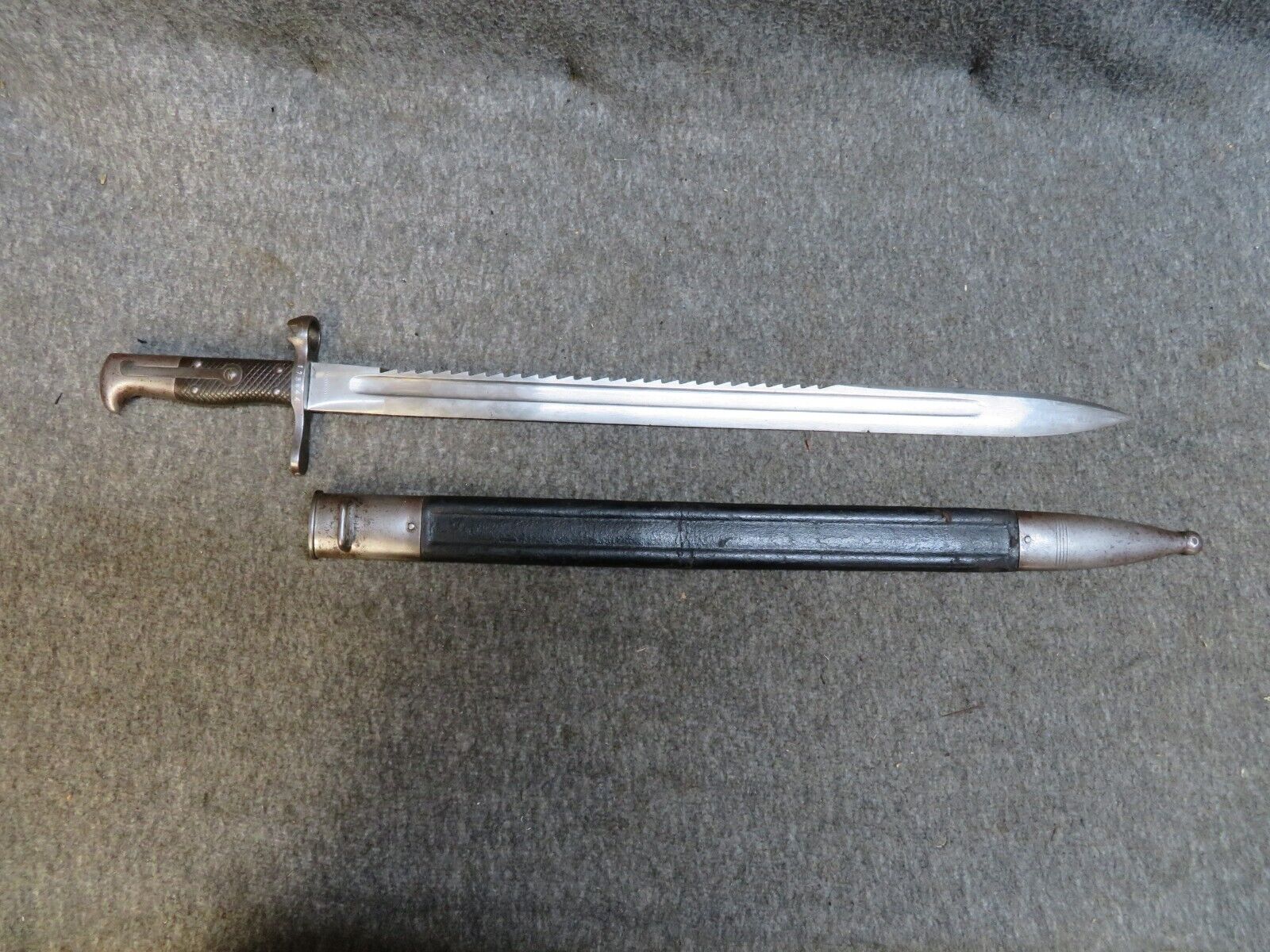Swiss Model 1878 Vetterli Pioneer Sawback Bayonet – S.J.G. Neuhausen with Scabbard | Rare Collectible