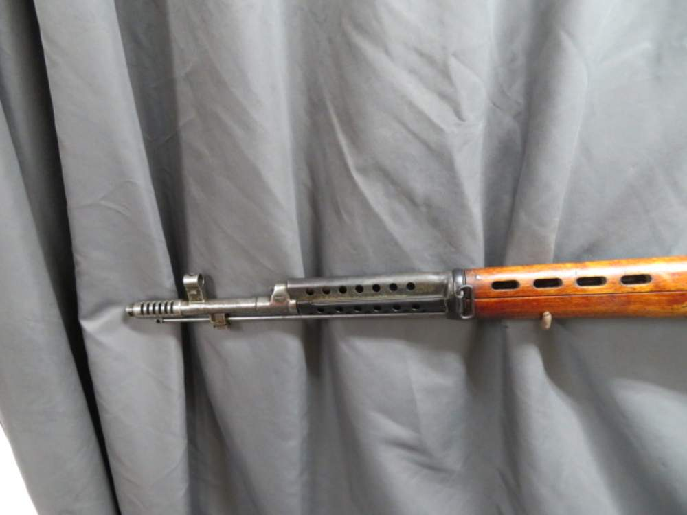 Close-up of the SVT-40's gas block and slotted muzzle brake