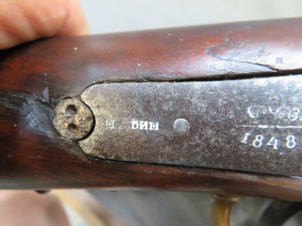 Cyrillic arsenal markings and date stamped near the lock