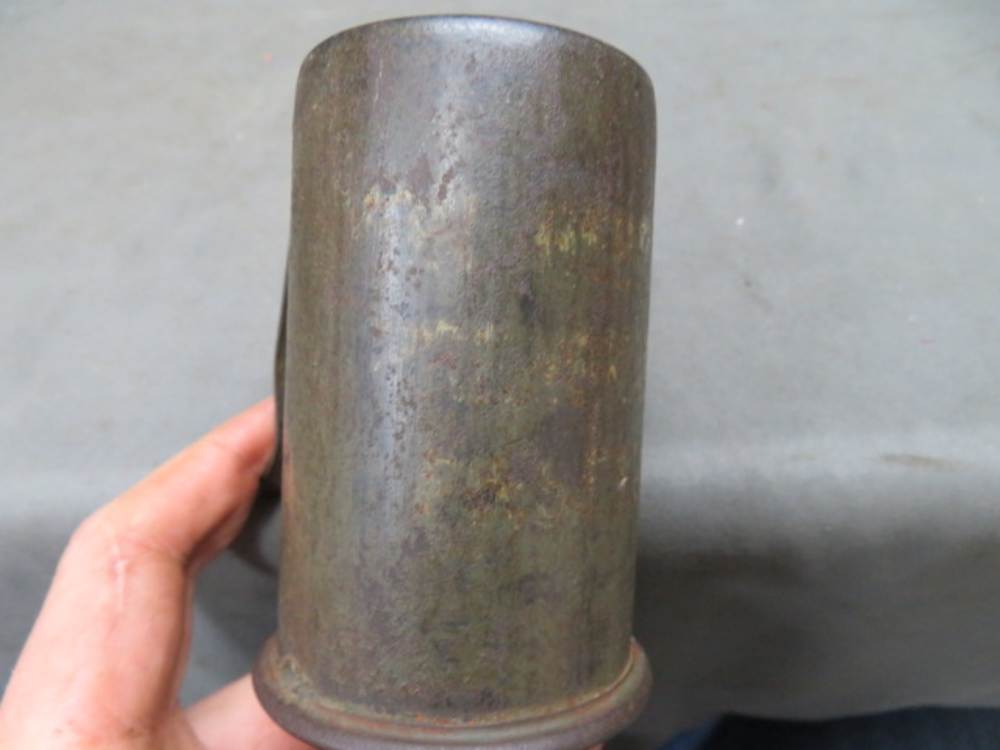 Close-up of the cylindrical steel head of a German Model 1917 stick grenade