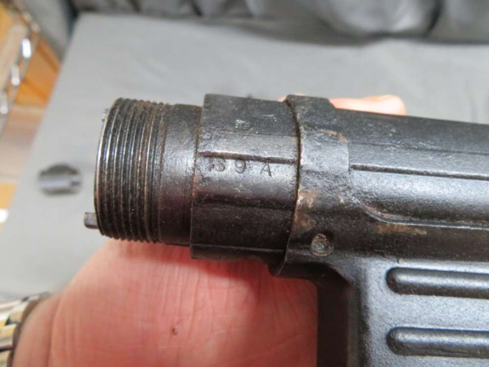 Close-up of a wartime acceptance stamp on an MP 40 barrel collar