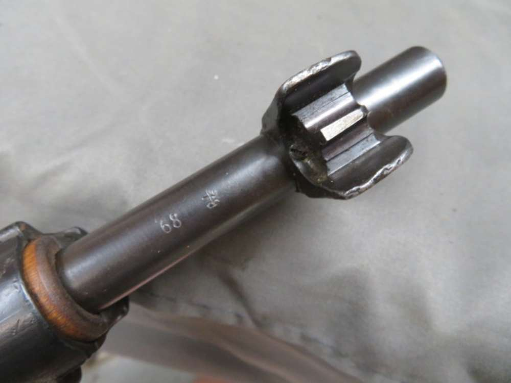 Close-up of the bolt head and locking lugs showing the matching serial number on a Finnish SAKO M/28-30 Mosin-Nagant rifle