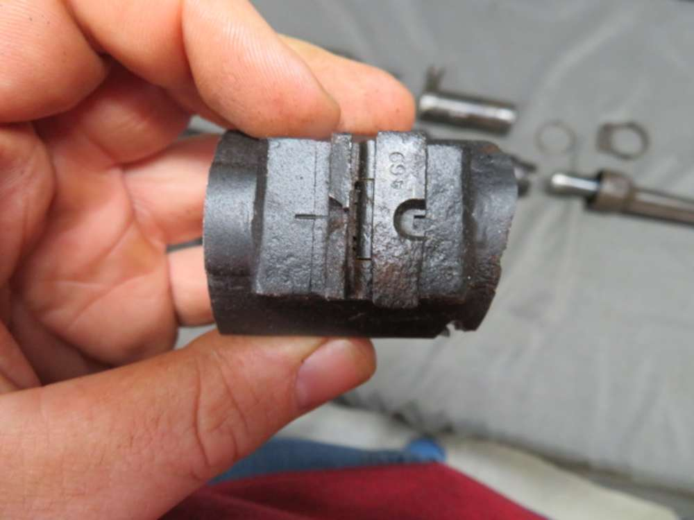 Close-up of a manufacturer's code stamped on an MP 40 barrel component