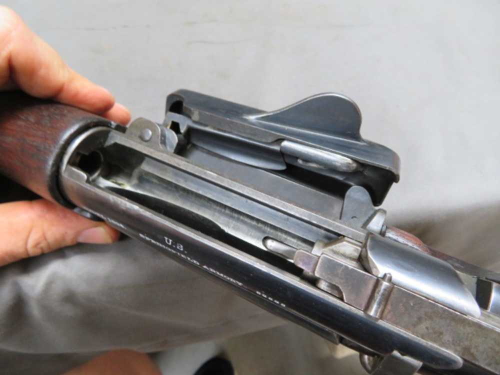Open side-loading magazine gate on the Krag receiver, showing the mechanism that let soldiers top off rounds without working the bolt. Photo property of Eisel Armory.