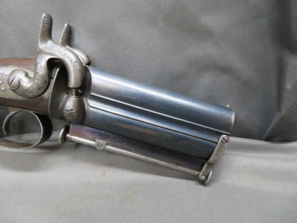 Close-up of the Rodda howdah pistol's cocked hammers and side-by-side barrels