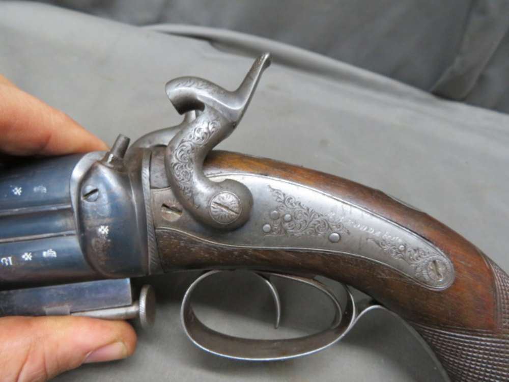 Close-up of the hammer and maker's engraving on the Rodda howdah pistol