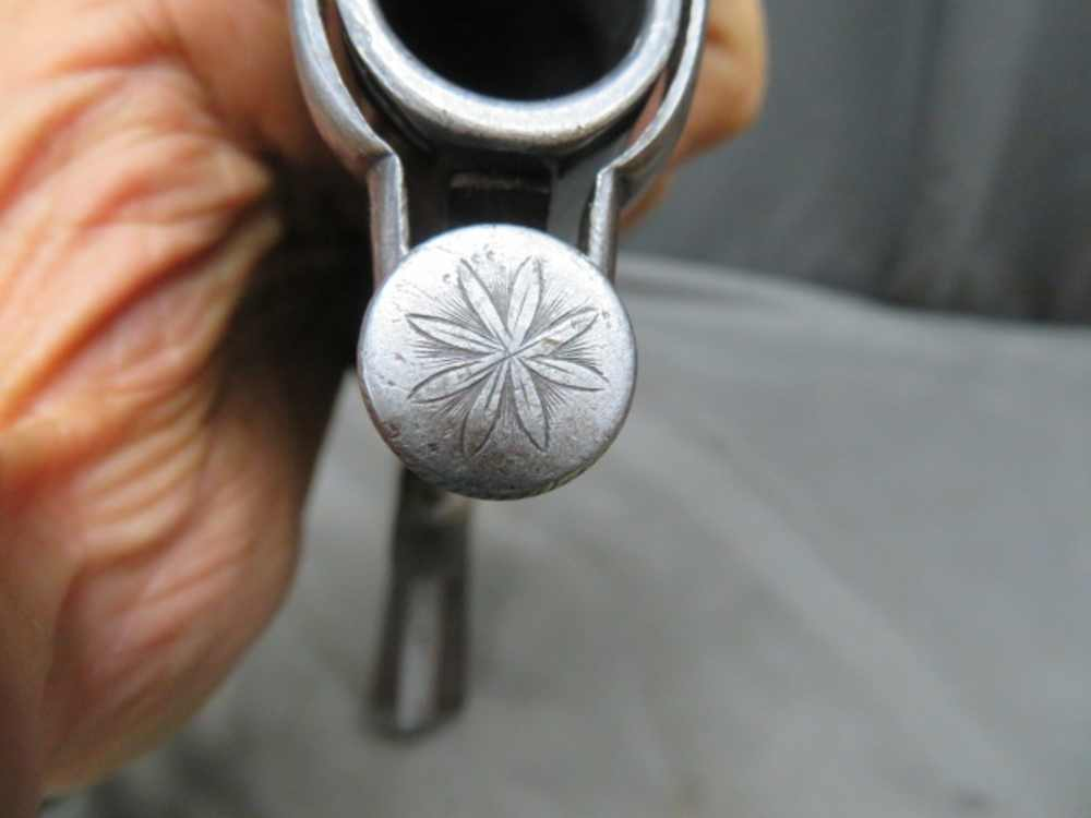 Close-up of the engraved rosette on the muzzle end of the Rodda howdah pistol
