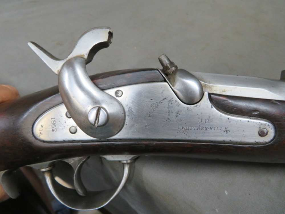 Close-up of the U.S. WHITNEY-VILLE maker's mark and 1862 date stamped on the lock plate